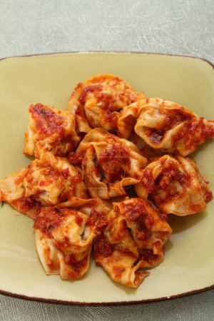 Photo for Italian ravioli with meat, tomato sauce and basil - Royalty Free Image