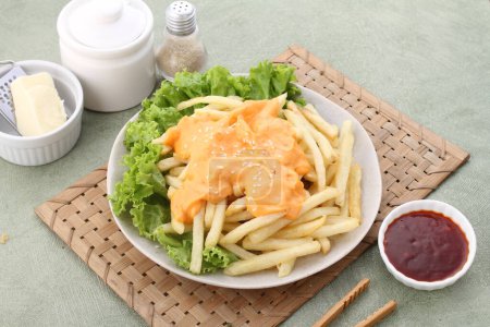 Photo for French fries with cheese and salad - Royalty Free Image