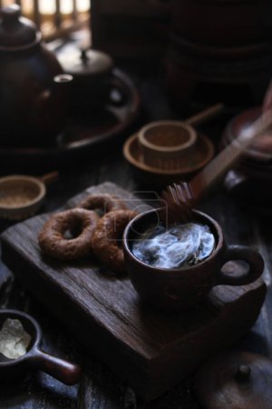 Photo for Coffee grinder and cup of coffee on wooden table - Royalty Free Image