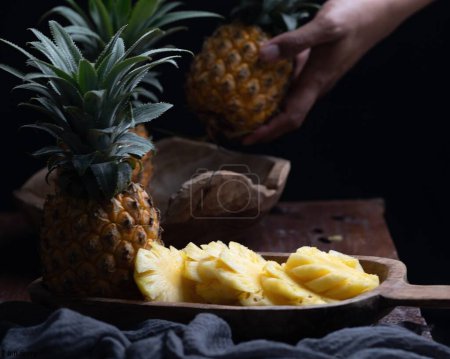Photo for Fresh organic pineapple on black background - Royalty Free Image