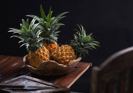 Photo for Pineapple and pineapple on black background - Royalty Free Image