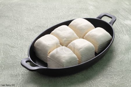 Photo for Fresh white marshmallows in a pan on a black background. - Royalty Free Image