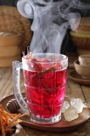 Photo for Red tea and hot drink in a glass cup - Royalty Free Image