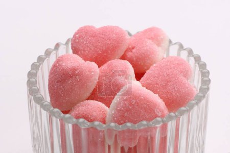 Photo for Heart - shaped candy with sugar in pink bowl - Royalty Free Image