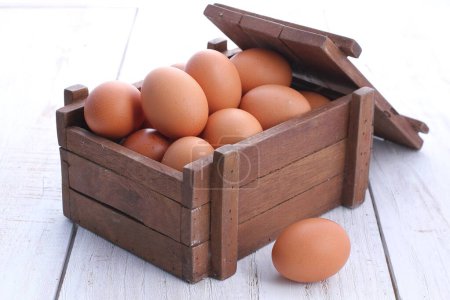 Photo for Eggs in a wooden crate - Royalty Free Image