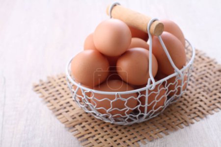 Photo for Fresh eggs in a basket. close up photo. - Royalty Free Image