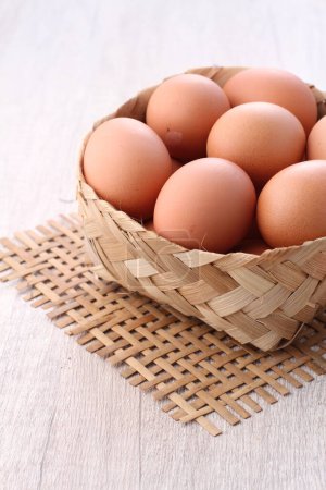 Photo for Fresh eggs in wooden bowl - Royalty Free Image