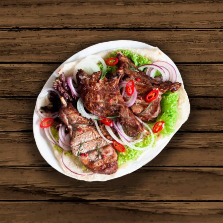 Photo for Grilled meat on brown wooden background - Royalty Free Image