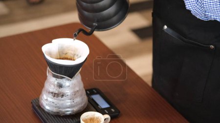Foto de Latina volcano dripper with coffee paper for make coffee. - Imagen libre de derechos