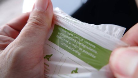 Foto de Plastic strength test made of plant based cassava. Biodegradable plastic bag. Jakarta, 20 january 2022. - Imagen libre de derechos