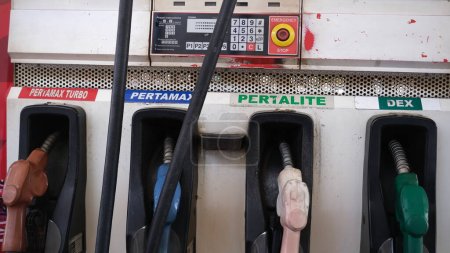 Foto de Filling station with gasoline type of Pertamax Turbo, Pertamax, Pertalite and Dex. Jakarta, 18 august 2022. - Imagen libre de derechos
