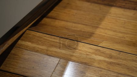 Photo for Corrugated wooden floor due to expansion at Kitchen. - Royalty Free Image