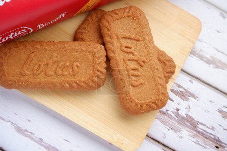Photo for Lotus Biscoff biscuit on wooden tray with white background. - Royalty Free Image