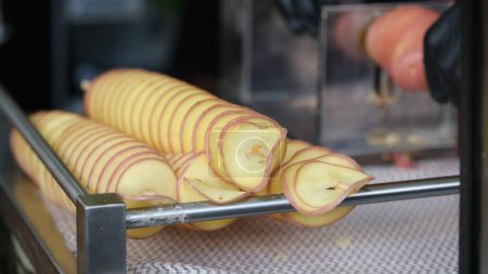 Spiral frying potato at a street vendor.