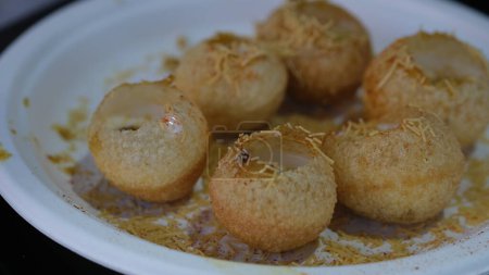 Dahi Puri is an Indian snack food. The dish is a type of chaat and originates from the city of Mumbai. It is served with mini-puri shells Golgappa
