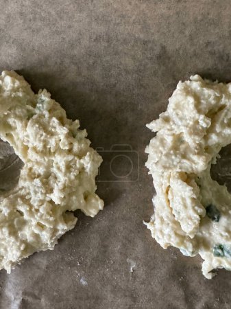 Vertical photo of Prepared cottage bagel dough rounds. High quality photo