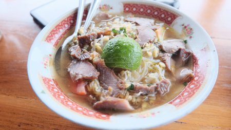 Photo for Klayar beach pacitan, east java - Indonesia : Selective Focus Soto Beef or Soto Beef, is an Indonesian Special Soup. This dish is made from beef broth with chunks of meat. - Royalty Free Image