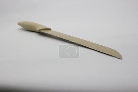 Photo for Long knife in gray color, white background. - Royalty Free Image