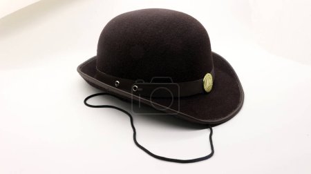 Scout members' hats, which are round for girls and are brown in color.