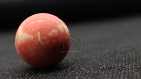 Traditional Indonesian toy bekel ball isolated on black background