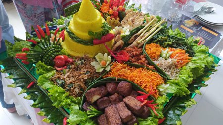 Tumpeng rice is served to be eaten together on Kartini's Day