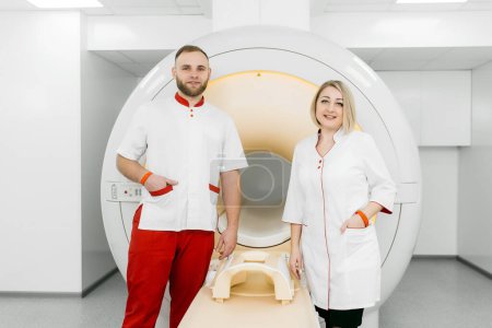 Photo for MRI or PET scan of a patient in a modern clinic. Magnetic resonance imaging in the study of the human body. The doctor prepares the apparatus for computed tomography - Royalty Free Image