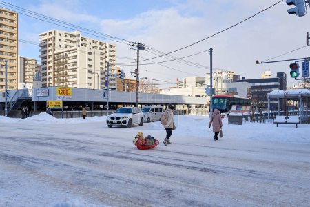 Photo for Hokkaido, Japan  - December 20, 2022 : Snow-covered streets of Sapporo. Sapporo downtown is popular tourist attractions in Hokkaido,Japan - Royalty Free Image