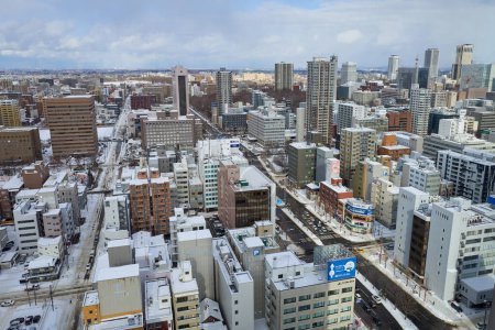 Foto de Hokkaido, Japan  - December 20, 2022 : Aerial view of cityscape of winter Sapporo, Hokkaido, Japan - Imagen libre de derechos