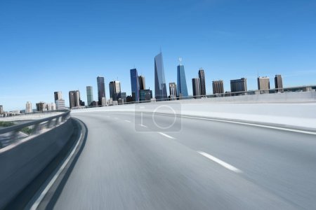 Téléchargez les photos : 3d rendering Highway overpass motion blur with modern city background - en image libre de droit