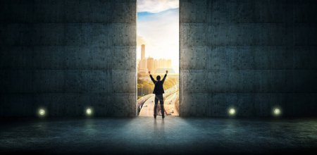 Photo for Success  businessman cheering against concrete wall with huge door ,sunrise scene city skyline outdoor view . - Royalty Free Image