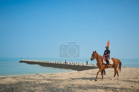 Photo for PENANG , MALAYSIA - Sep 29,2023 : Tourist riding a horse at the Batu Ferringhi beach of Penang Island - Royalty Free Image