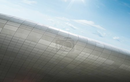 Abstract view of a building with a curved design under a sunny sky