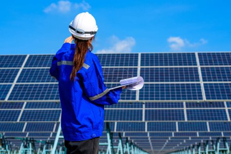Photo for Engineer worker portrait with solar panel at solar farm, Solar farm with engineer workers analyzing solar cell, Renewable energy engineers work production of energy renewable or sustainable source - Royalty Free Image