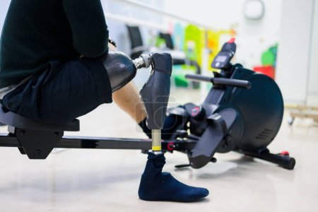 Photo for Disabled sporty man exercising with prosthetic leg at gym, People with high tech technology at prosthetic manufacturing, New artificial limb production for disabled people - Royalty Free Image