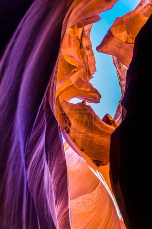 Low angle view of rock formations. Antelope Canyon in the Navajo Reservation Page Northern Arizona. Light showing off the glamorous detail of the ancient spiral rock arches. Popular destinations for hikers. Most photographed slot canyons in the world
