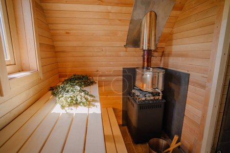 Photo for Inside the sauna bath with stove and broom - Royalty Free Image