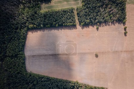 Photo for Aerial view over the green fields of early summer and the double carriageway from the air. - Royalty Free Image