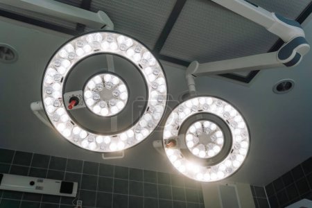 Valmiera, Latvia - March 20, 2024 - overhead surgical lights in an operating room, turned on and shining brightly, typically used to provide a clear view during medical procedures.