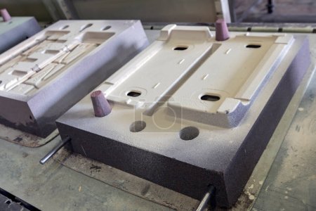 Photo for View of the sand mold casting. Sand casting, also known as sand molded casting, is a metal casting process characterized by using sand as the mold material. - Royalty Free Image
