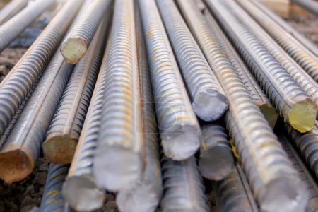Photo for Rebars. It is a steel bar or mesh of steel wires used as a tension device in reinforced concrete and reinforced masonry structures to strengthen. Steel bars on construction site. - Royalty Free Image