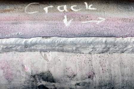 Photo for View of the crack between weld metal and base metal ( heat affected zone, haz) and magnetic particle inspection. It is a crack that forms a short distance away from the fusion line. Ndt, asme, astm. - Royalty Free Image