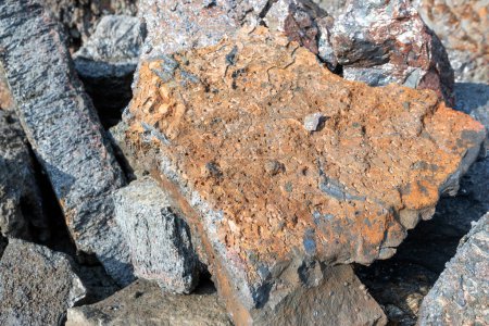 Photo for View of the heap of the copper slag in the copper mine factory. Copper slag is a by-product of copper extraction by smelting. During smelting, impurities become slag which floats on the molten metal. - Royalty Free Image