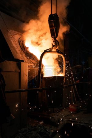 Photo for Industrial furnace for steel and iron casting. A furnace is a device used for high-temperature heating. The heat energy to fuel a furnace may be supplied directly by fuel combustion. - Royalty Free Image