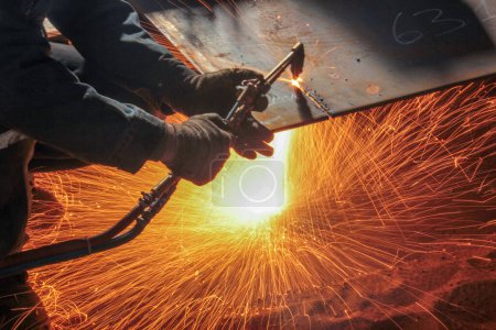 Photo for Welding, or gas welding in the U.S. and oxy-fuel cutting are processes that use fuel gases and oxygen to weld and cut metals, respectively. - Royalty Free Image