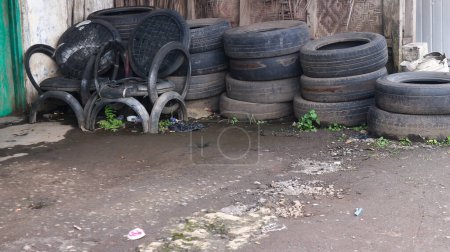 Photo for Pile of old tires and wheels for recycling rubber. tire patch on the side of the road. - Royalty Free Image