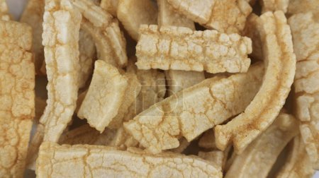 Rambak or kerupuk kulit sapi. Cow skin cracker is common side dish in Indonesia made from fried seasoned cow skin. perfect for recipe, catalog or any cooking contents.