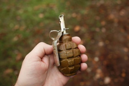 Russian (soviet) hand grenade F1 in man's hand