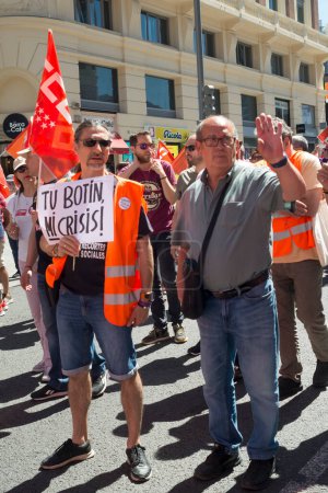Photo for People attended the 1st May Labour Day demonstration organised by the CCOO and UGT in the centre of Madrid and other major cities in Spain. The union leaders said that there are two ways to solve plight of workers today: negotiate with us or we take - Royalty Free Image
