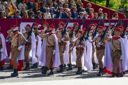 Photo for Regulares regiment from Ceuta and Melila with their white cape . Some 4,100 military personnel participated during the National Day military parade including King Felipe VI, Queen Letizia, and Princess Leonor, in Madrid Spain. - Royalty Free Image