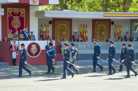 Photo for Marching soldiers in front of King Filipe Vi, some 4,100 military personnel participated during the National Day military parade including King Felipe VI, Queen Letizia, and Princess Leonor, in Madrid Spain.i - Royalty Free Image